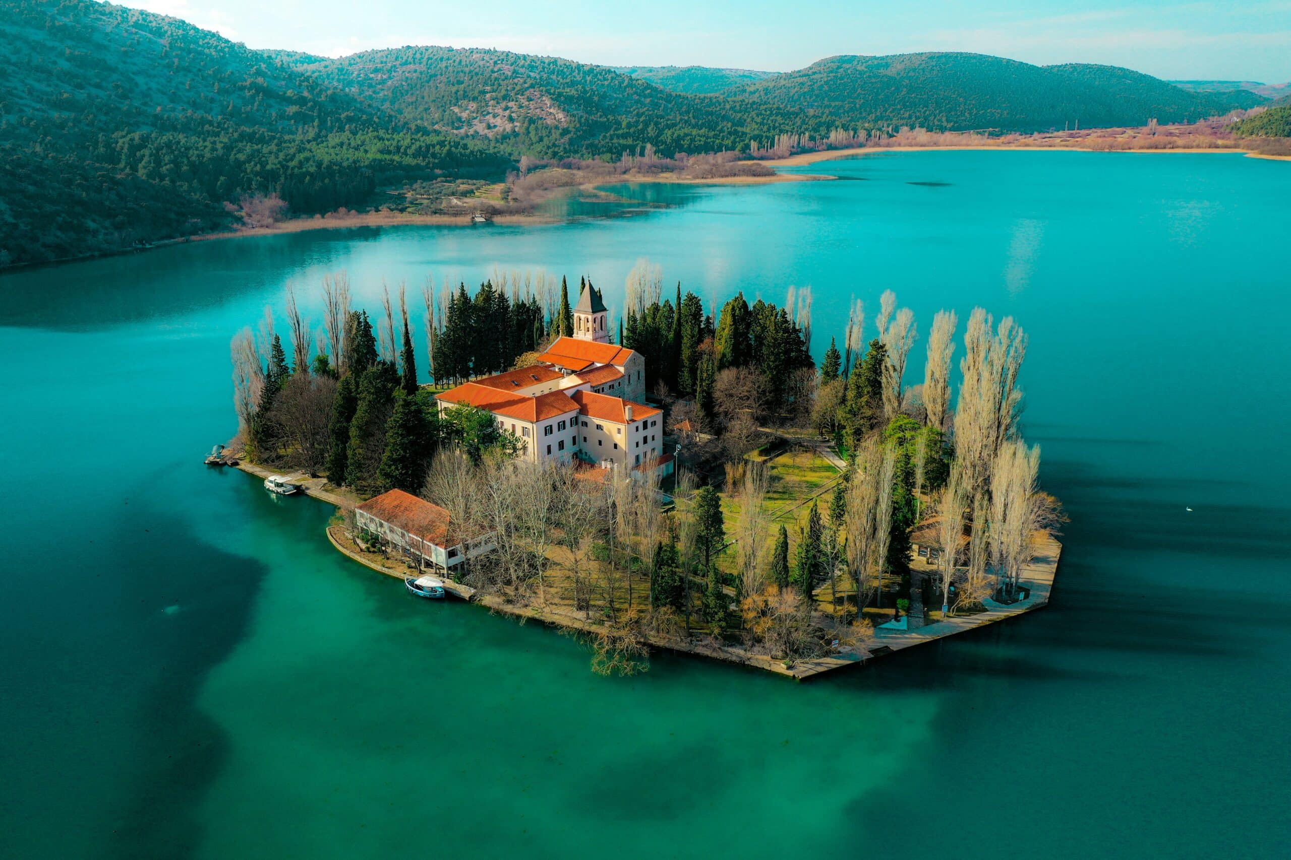 Luxury catamaran sailing through turquoise waters near Croatia