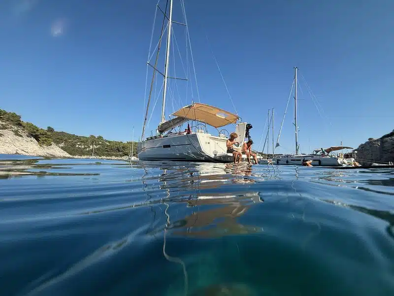 Sailing yacht anchored in turquoise Mediterranean bay
