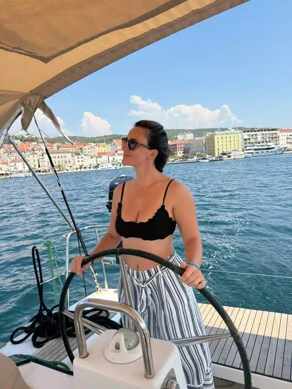 Student at the helm navigating Croatian coastline